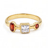 Natural garnet and Swarovski crystal ring in 18K gold plated and silver plated finishes featuring oval, round, and square bezel-set gemstones