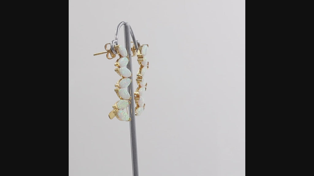 360 degree view of Opal quartz marquise ear climber earrings in 1 micron 18K gold plated finish shown on a white background.