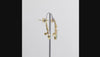 360 degree view of Gold-plated ear climber earrings featuring a marquise-cut Swarovski crystal stone, a pear-shaped light green aquamarine stone, a round pearl, and small clear accent stones, views on a white background.
