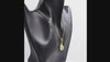 360 degree view of a gold pendant necklace featuring a Nautilus shell design with a round turquoise blue stone in the center, suspended from a gold box chain against a white background.