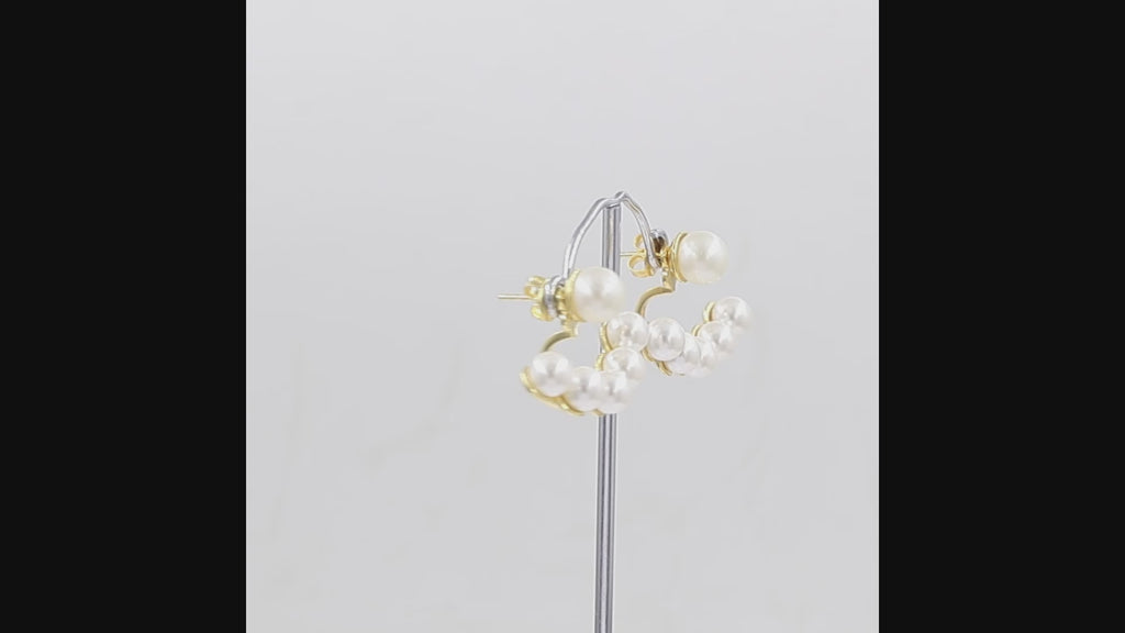 360-degree video of pearl glass ear jacket earrings ,gold plated, display on a white background