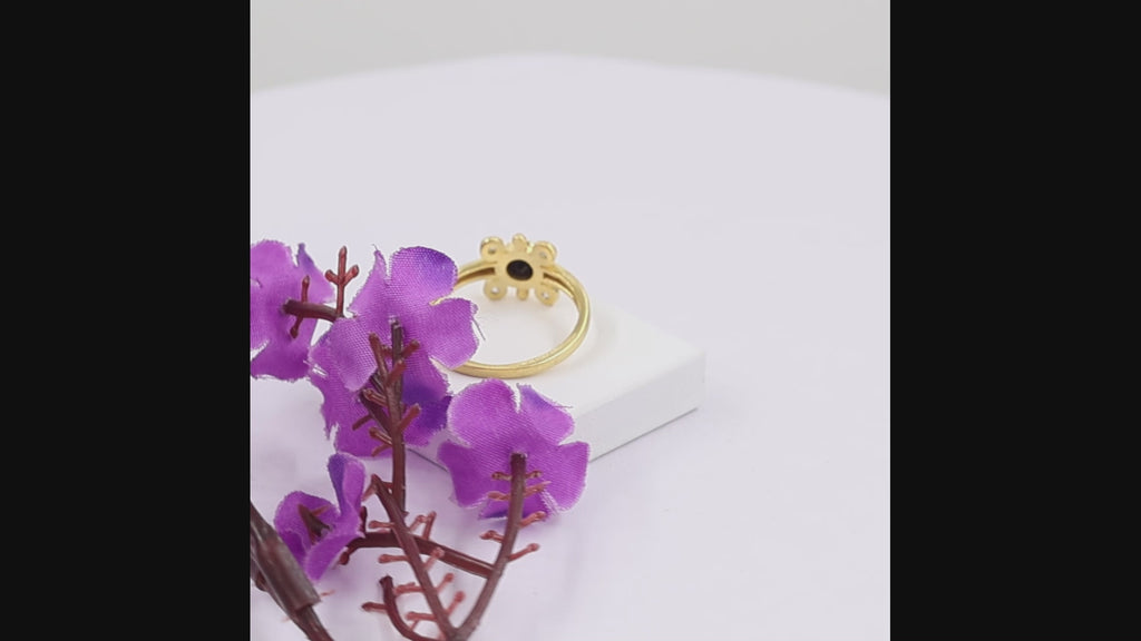 Natural black onyx ring in 18K gold plated finish with one 5×5 mm round black onyx gemstone and four Swarovski crystal accents.