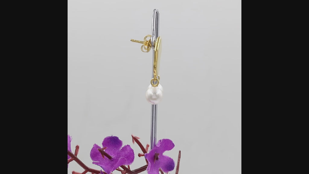 Natural freshwater pearl drop earrings with round 7×7 mm pearls.