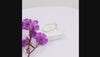 
Natural tanzanite and Swarovski crystal bezel ring in 18K gold plated and silver plated finishes with round gemstones.