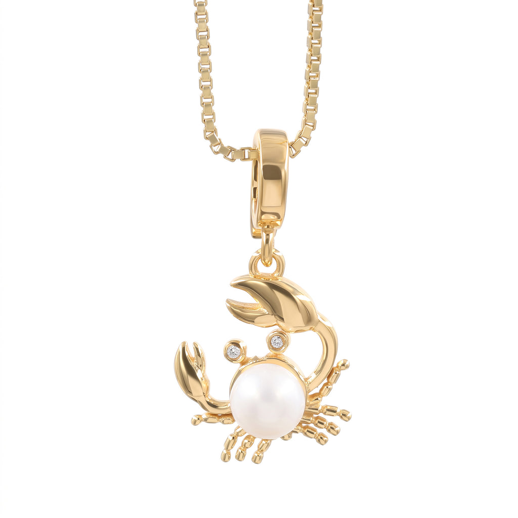 360 degree view of a gold-plated lobster crab pendant necklace featuring a large white pearl belly and small clear Swarovski crystal for eyes, suspended from a gold box chain against a white background.