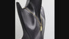 360 degree view of a Black onyx Taurus bull pendant necklace in 1 micron 18K gold plated finish, suspended from a gold box chain against a white background.
