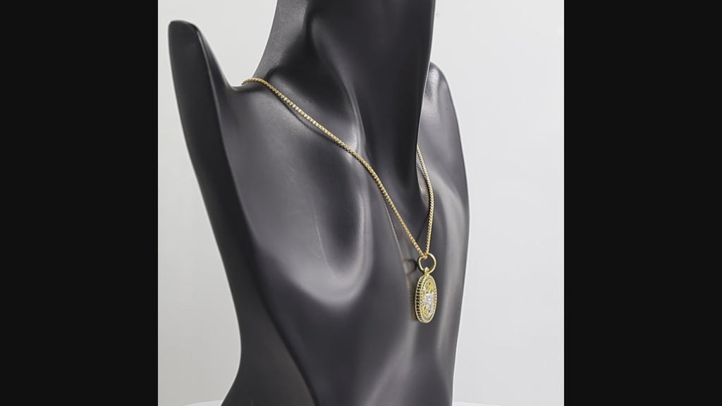 360 degree view of a Black onyx Taurus bull pendant necklace in 1 micron 18K gold plated finish, suspended from a gold box chain against a white background.