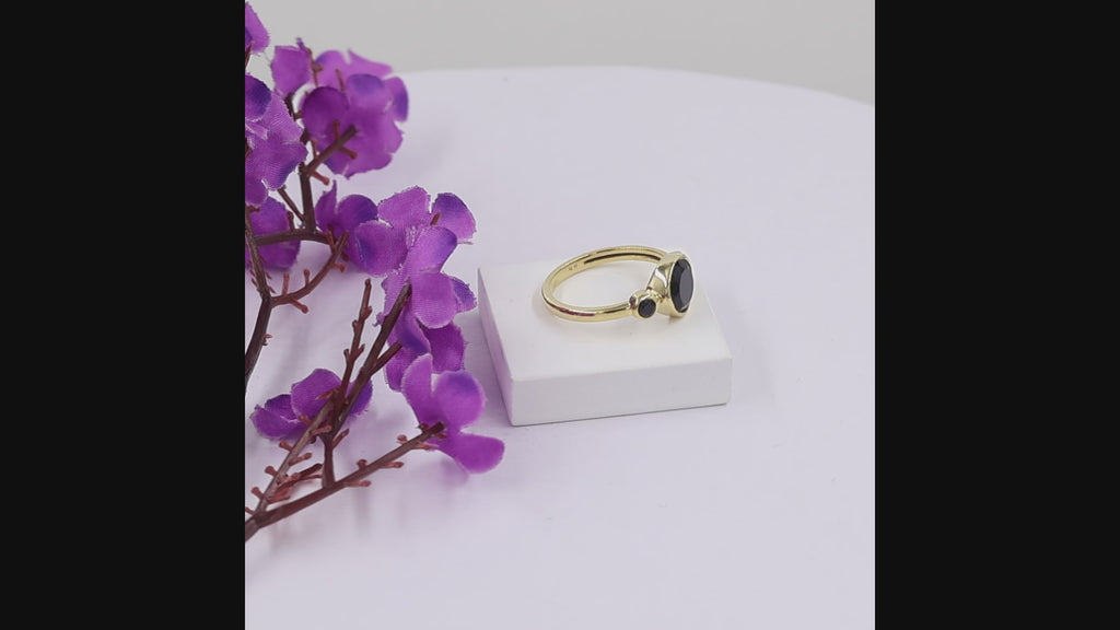 natural black onyx three stone ring in 18k gold plated finish with round bezel set gemstones
