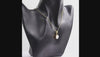 360 degree view of a Natural Shiva Eye round pendant necklace in 1 micron 18K gold plated finish