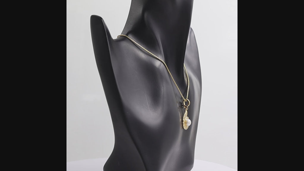 360 degree view of a Natural pearl nautilus shell pendant necklace in 1 micron 18K gold plated finish, suspended from a gold box chain against a plain white background.