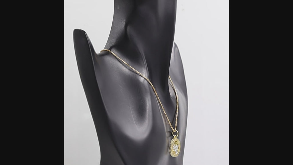 360 degree view of Swarovski Crystal Taurus bull pendant necklace in 1 micron 18K gold plated finish, suspended from a gold box chain against a white background.